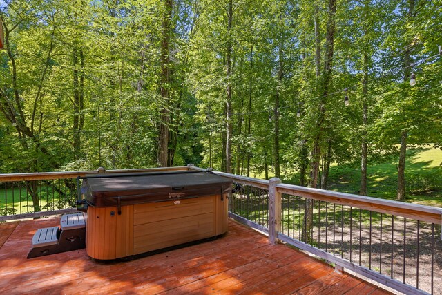 deck with a hot tub