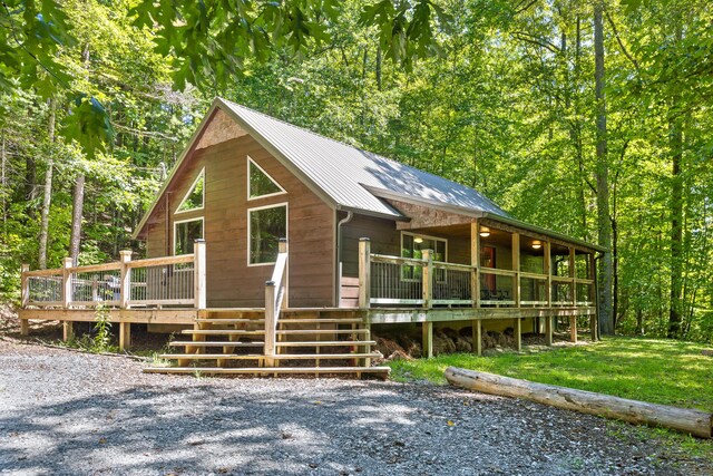 view of front of house with a front lawn and a deck