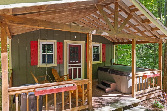 deck featuring a hot tub