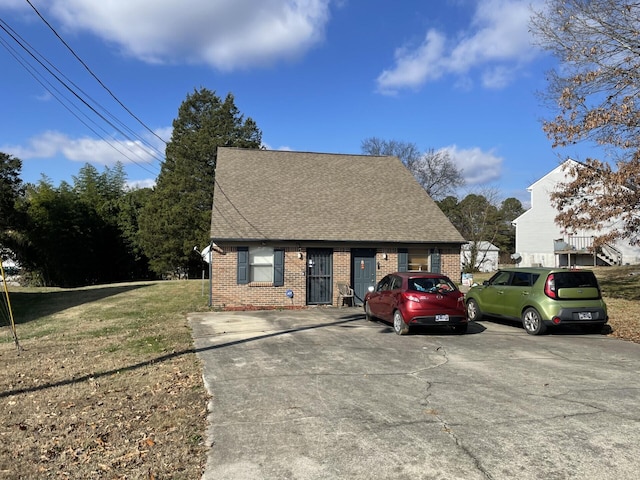 bungalow-style house with a front yard