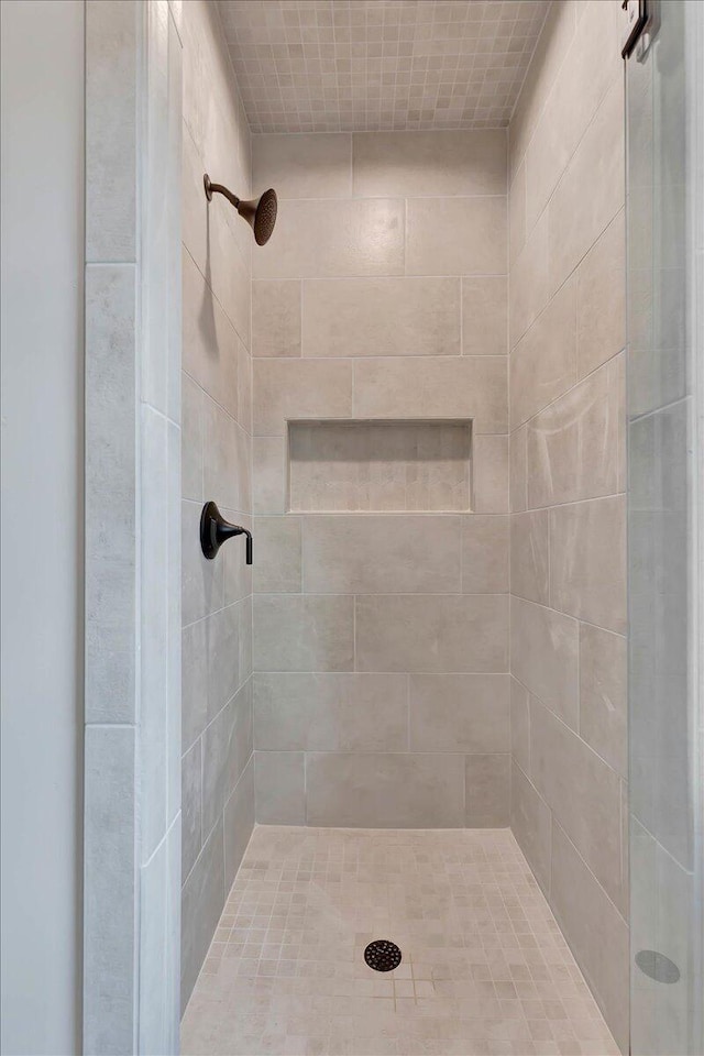 bathroom with tiled shower