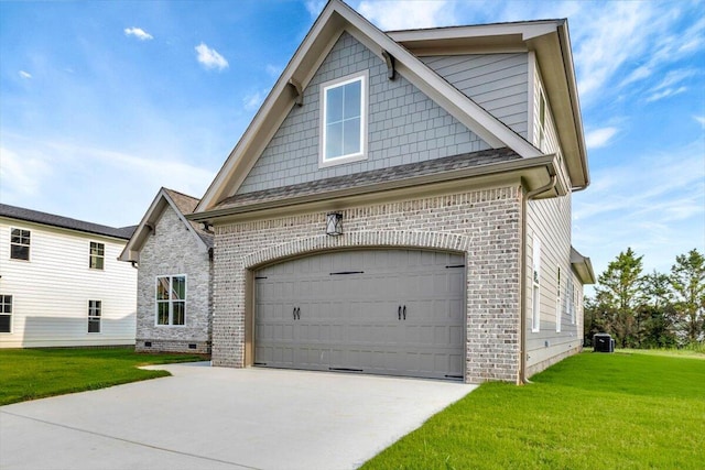 view of front of home with a front yard and a garage