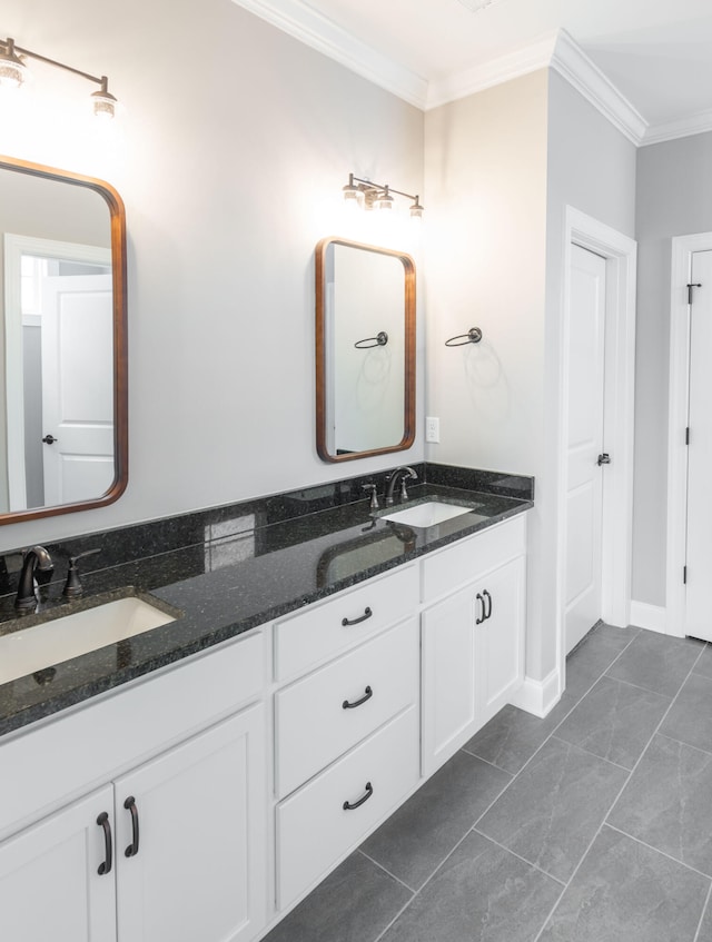 bathroom featuring ornamental molding and vanity