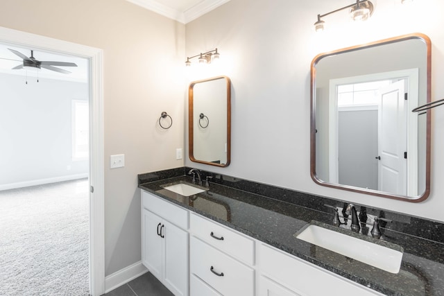 bathroom with ornamental molding, ceiling fan, and vanity