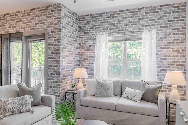 living room with brick wall