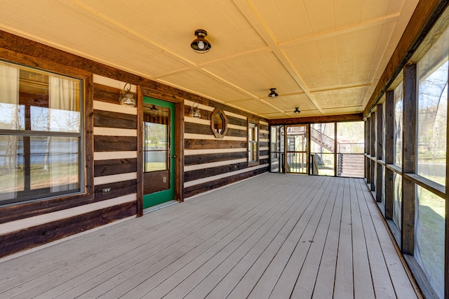 unfurnished sunroom featuring wood ceiling