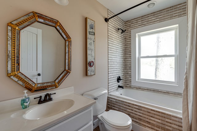 full bathroom with vanity, toilet, and shower / tub combo