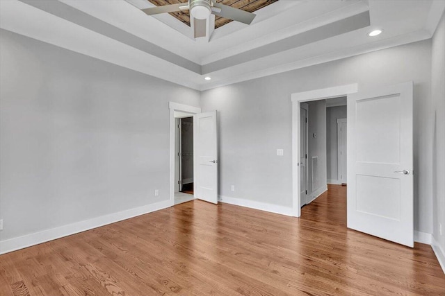 spare room featuring light hardwood / wood-style flooring and ceiling fan