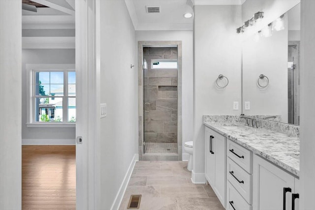 bathroom with vanity, an enclosed shower, crown molding, toilet, and hardwood / wood-style flooring