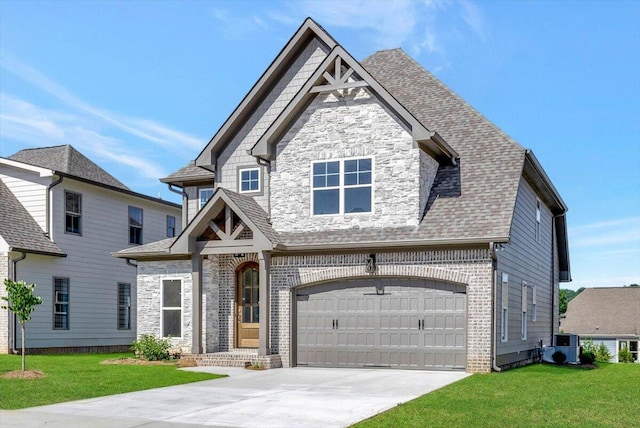 craftsman-style house featuring a garage, a front yard, and central AC