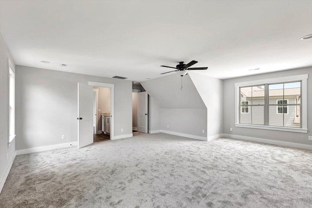 bonus room with visible vents, baseboards, carpet, and ceiling fan