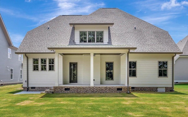 back of property featuring crawl space, a lawn, roof with shingles, and ceiling fan