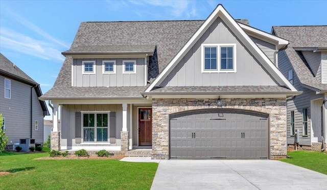 craftsman-style house with roof with shingles, board and batten siding, concrete driveway, and a front yard