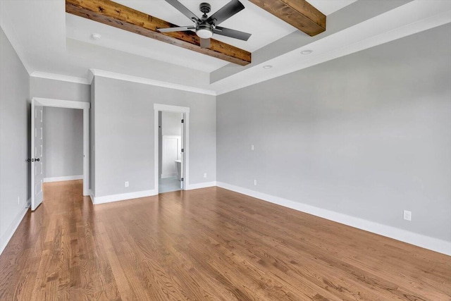 unfurnished bedroom featuring connected bathroom, hardwood / wood-style floors, beamed ceiling, and ceiling fan