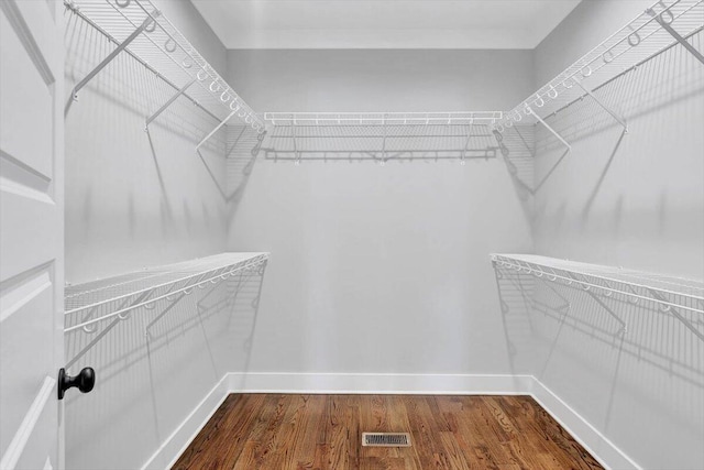 walk in closet featuring wood-type flooring