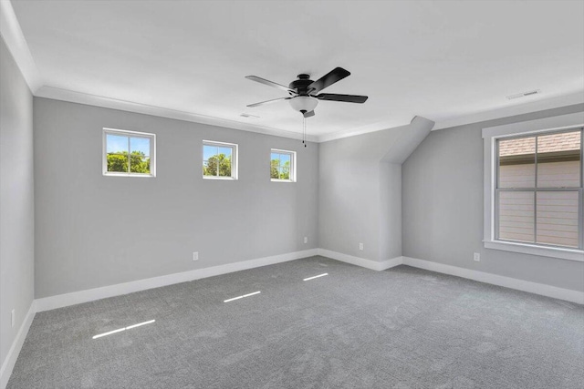 unfurnished room with crown molding, carpet, and ceiling fan