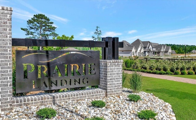 community / neighborhood sign featuring a residential view