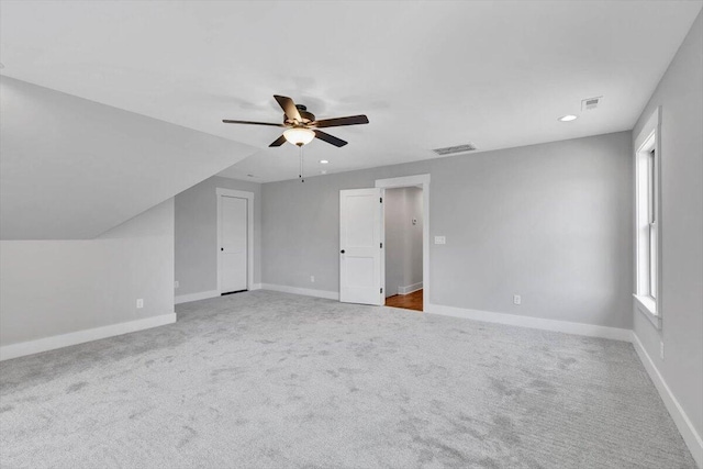 additional living space with carpet floors, vaulted ceiling, and ceiling fan