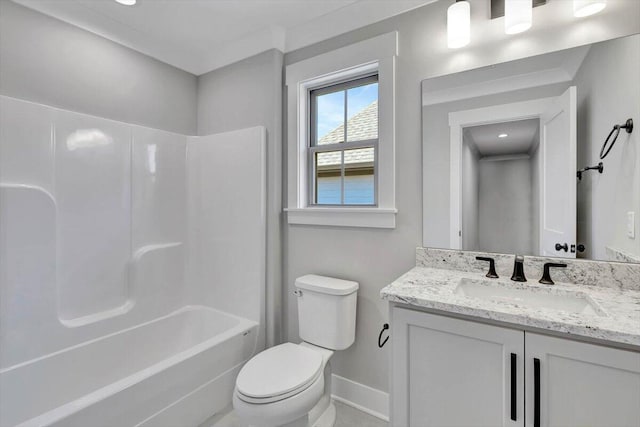 bathroom featuring vanity,  shower combination, toilet, and baseboards