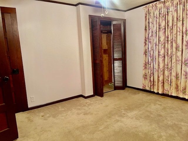 carpeted empty room with ornamental molding