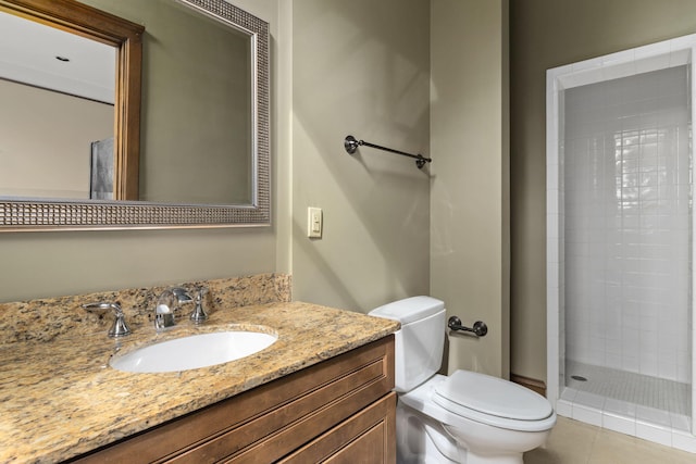 bathroom with vanity, toilet, a shower, and tile patterned flooring