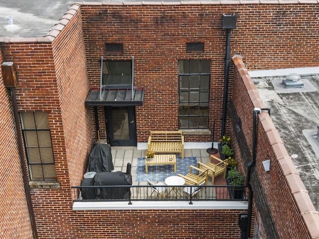 rear view of property featuring an outdoor living space