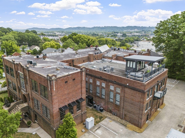 birds eye view of property featuring a mountain view