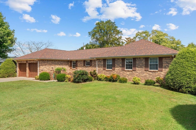 single story home with a front yard and a garage