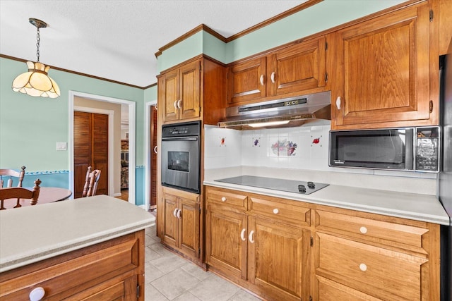 kitchen featuring a textured ceiling, backsplash, decorative light fixtures, light tile patterned floors, and black appliances