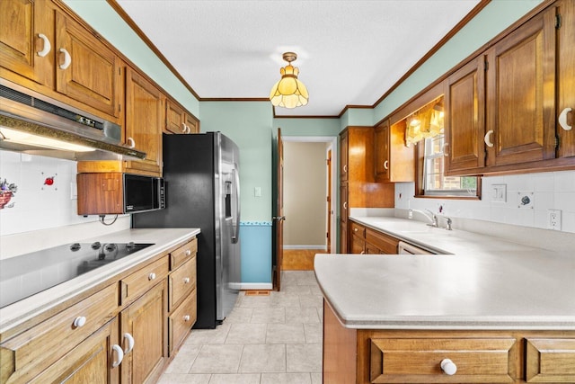 kitchen with ornamental molding, a textured ceiling, backsplash, black appliances, and sink