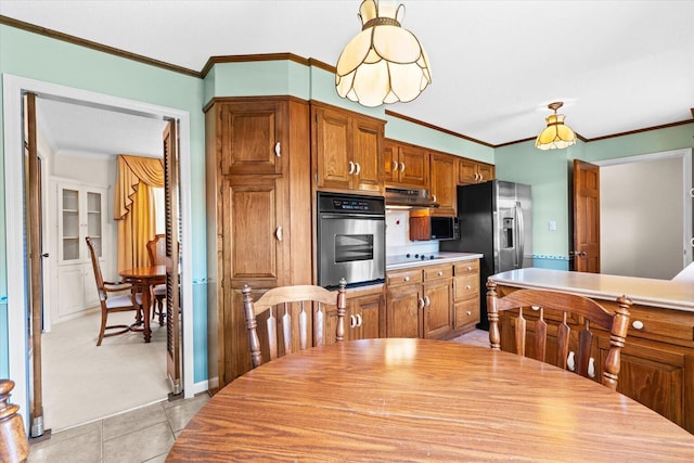 tiled dining room featuring crown molding