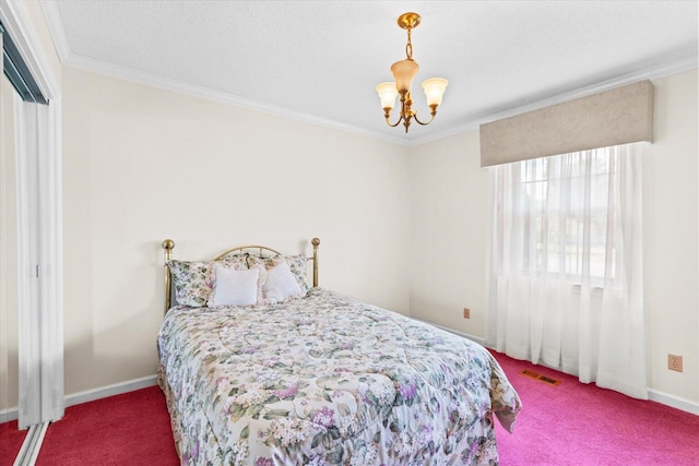 bedroom with a textured ceiling, ornamental molding, carpet floors, and an inviting chandelier