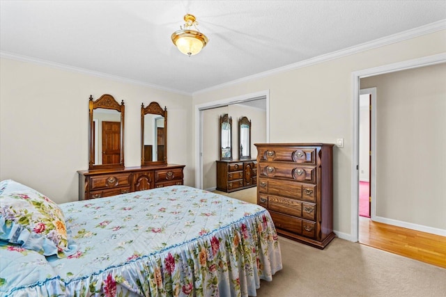 bedroom with ornamental molding, a closet, and light carpet