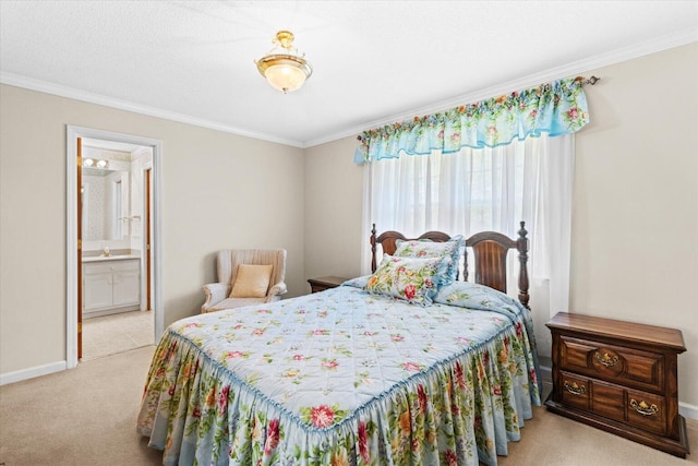 carpeted bedroom with crown molding and ensuite bath