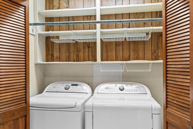 clothes washing area featuring washing machine and clothes dryer