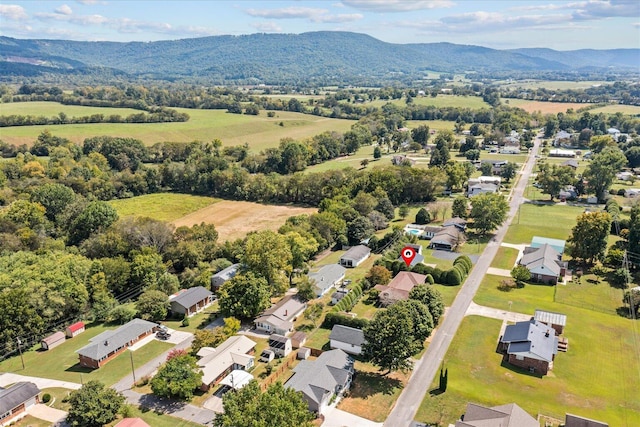 birds eye view of property with a mountain view