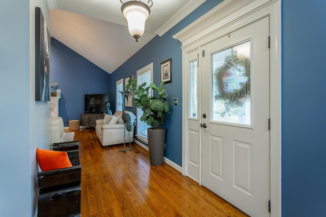 entryway featuring hardwood / wood-style flooring and lofted ceiling