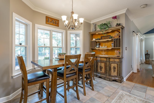 dining room featuring a notable chandelier and ornamental molding