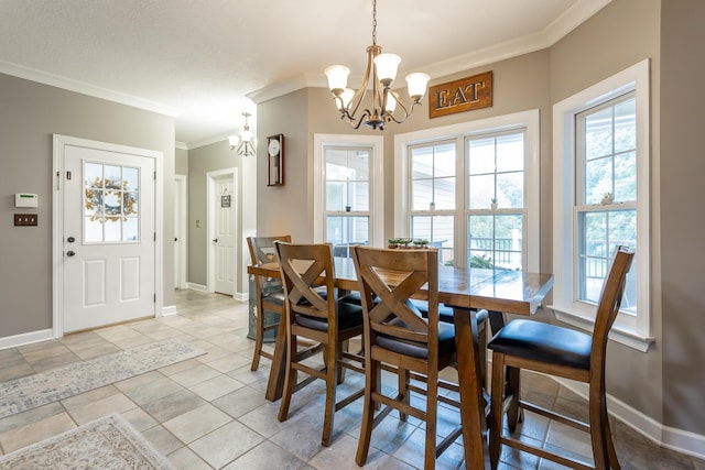 dining room with light tile patterned floors, crown molding, and an inviting chandelier