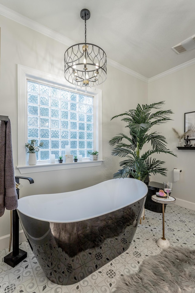 bathroom featuring a washtub, ornamental molding, tile patterned floors, and a notable chandelier