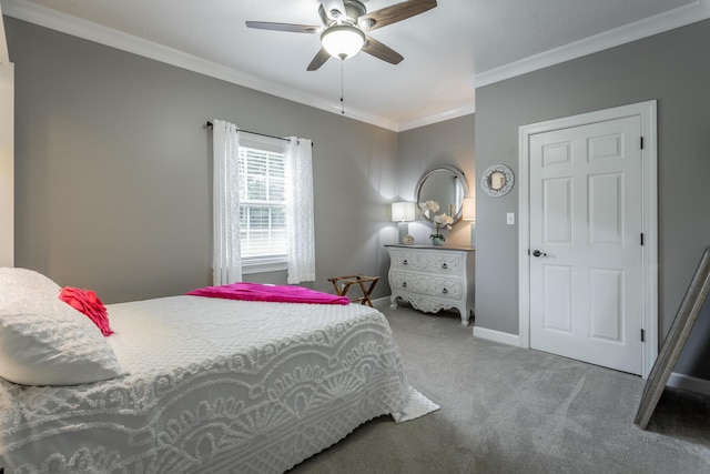 carpeted bedroom featuring ceiling fan and crown molding