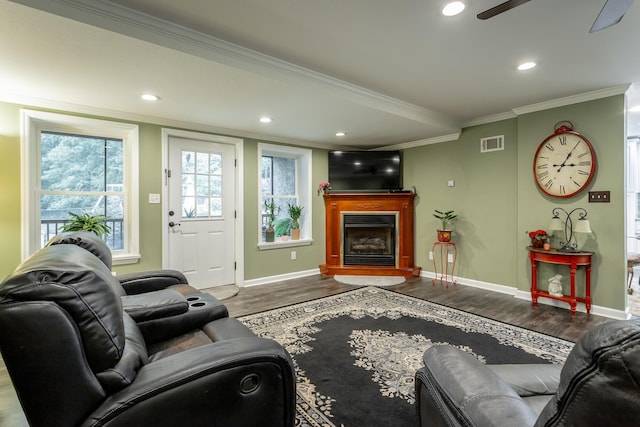 living room with ceiling fan, hardwood / wood-style floors, and crown molding