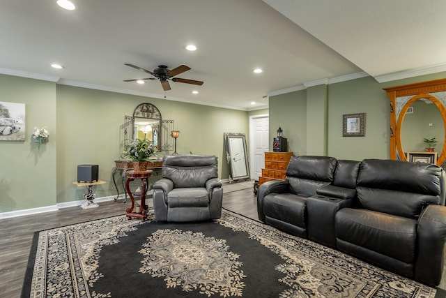 living room featuring hardwood / wood-style flooring, ceiling fan, and ornamental molding