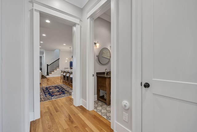 corridor with light hardwood / wood-style flooring