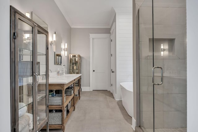 bathroom featuring separate shower and tub, vanity, and ornamental molding