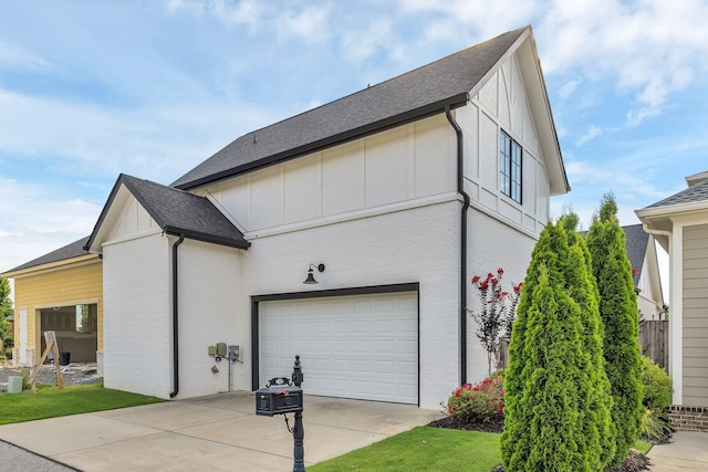 view of side of home featuring a garage