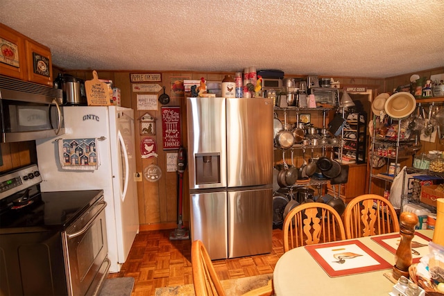 kitchen featuring a textured ceiling and appliances with stainless steel finishes