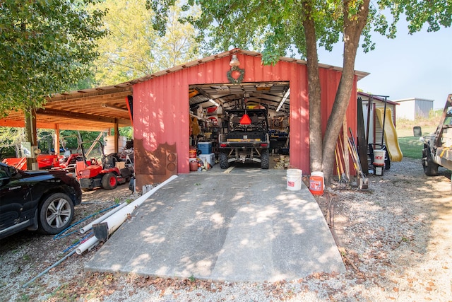 view of outbuilding featuring a carport