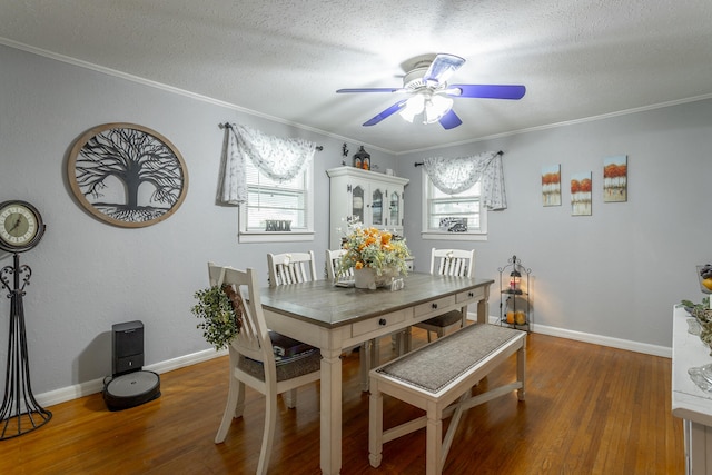 dining area with a wealth of natural light, ceiling fan, and dark hardwood / wood-style flooring