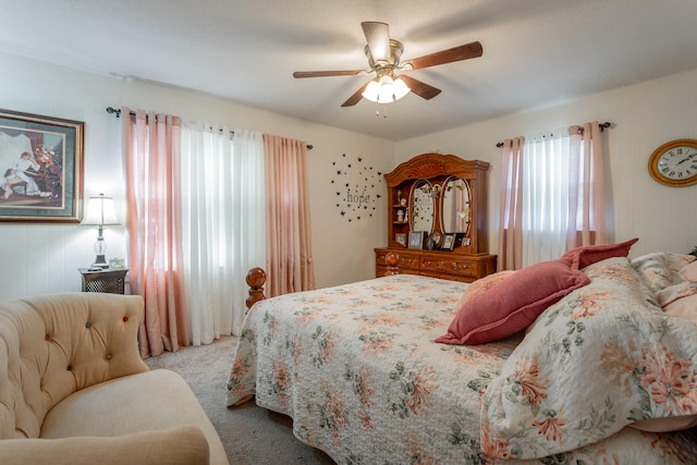 bedroom featuring ceiling fan and carpet